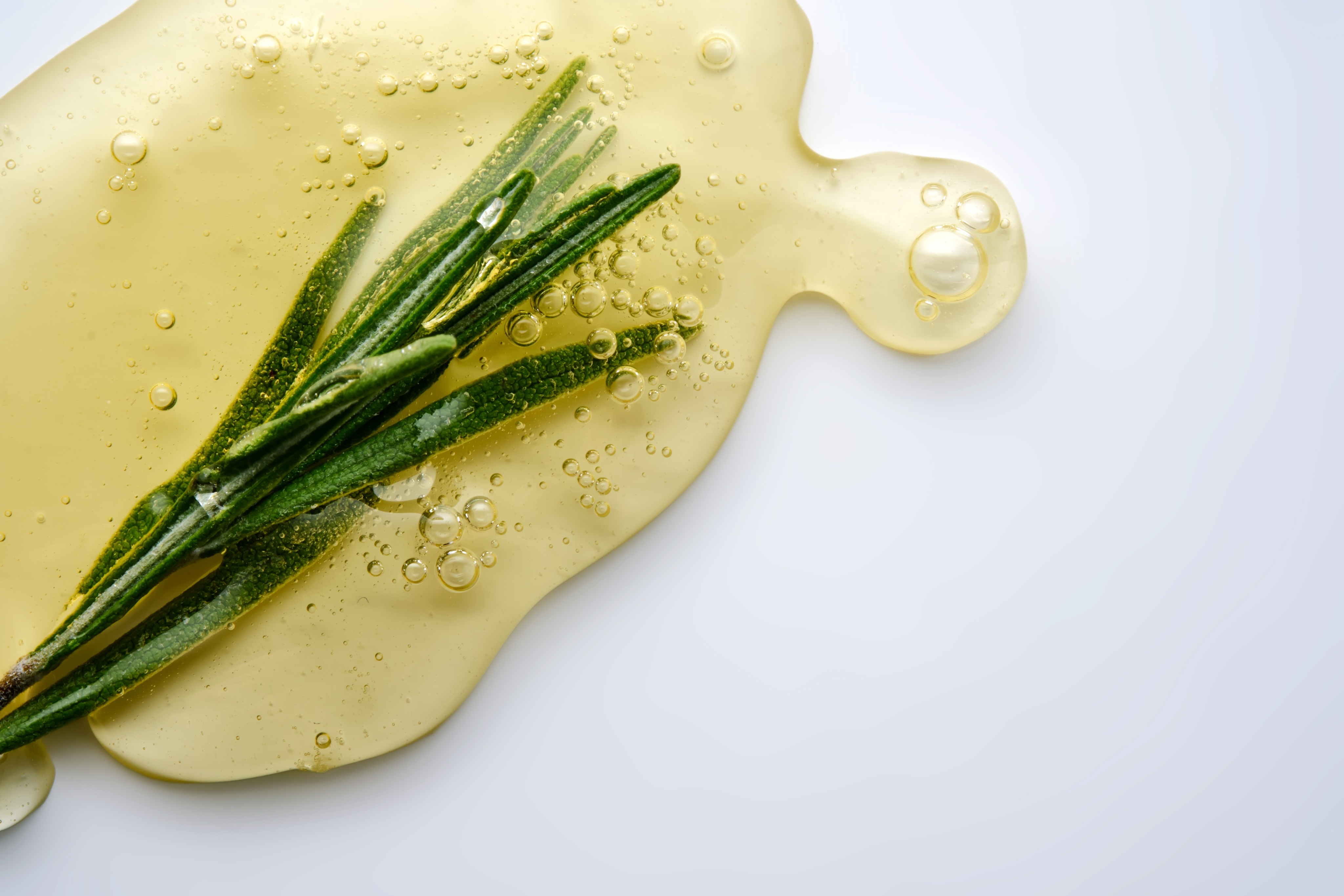 Two women sitting at a modern table talking with a city view behind them.